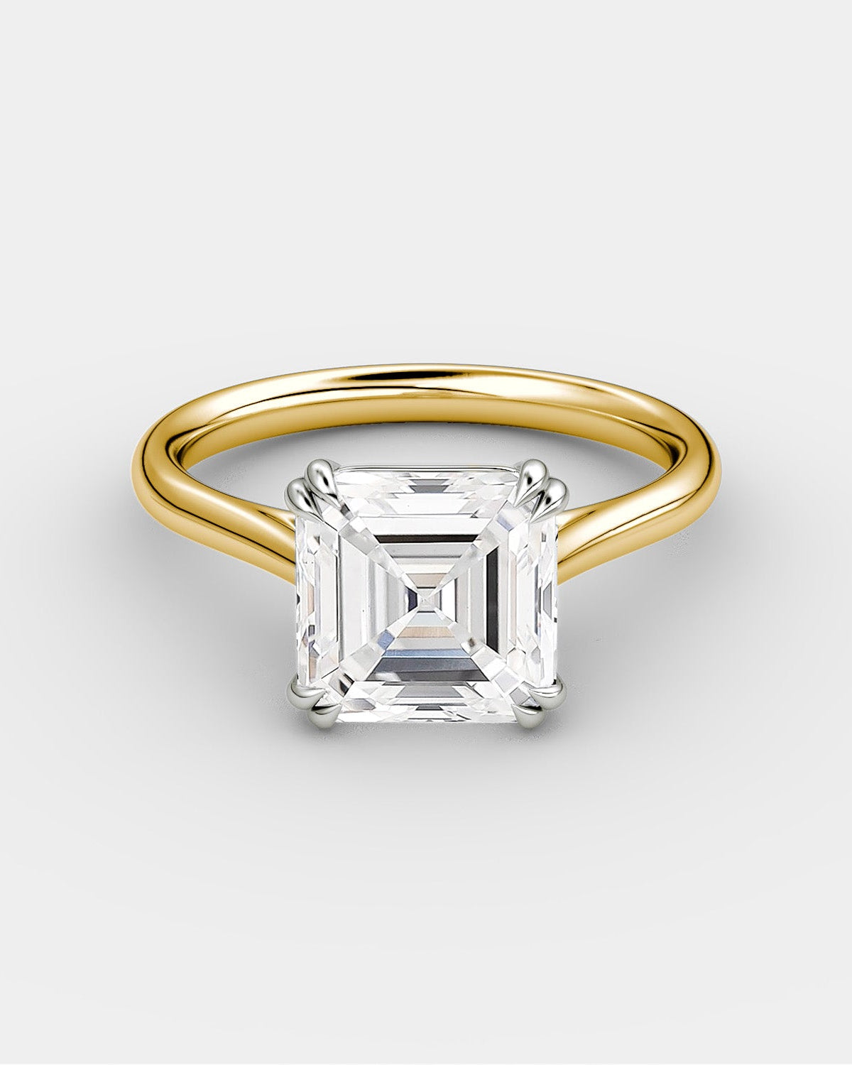 yellow gold engagement ring with a princess cut style diamond in a platinum setting