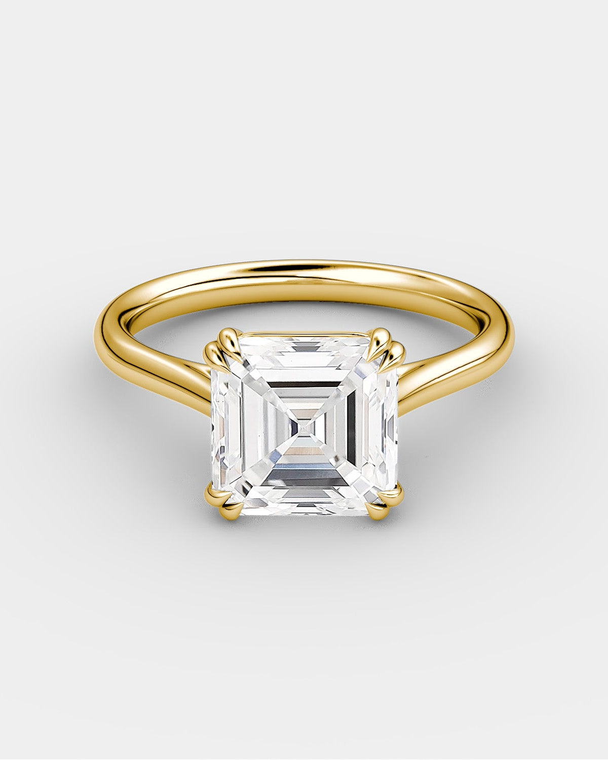 yellow gold engagement ring with a princess cut style diamond 