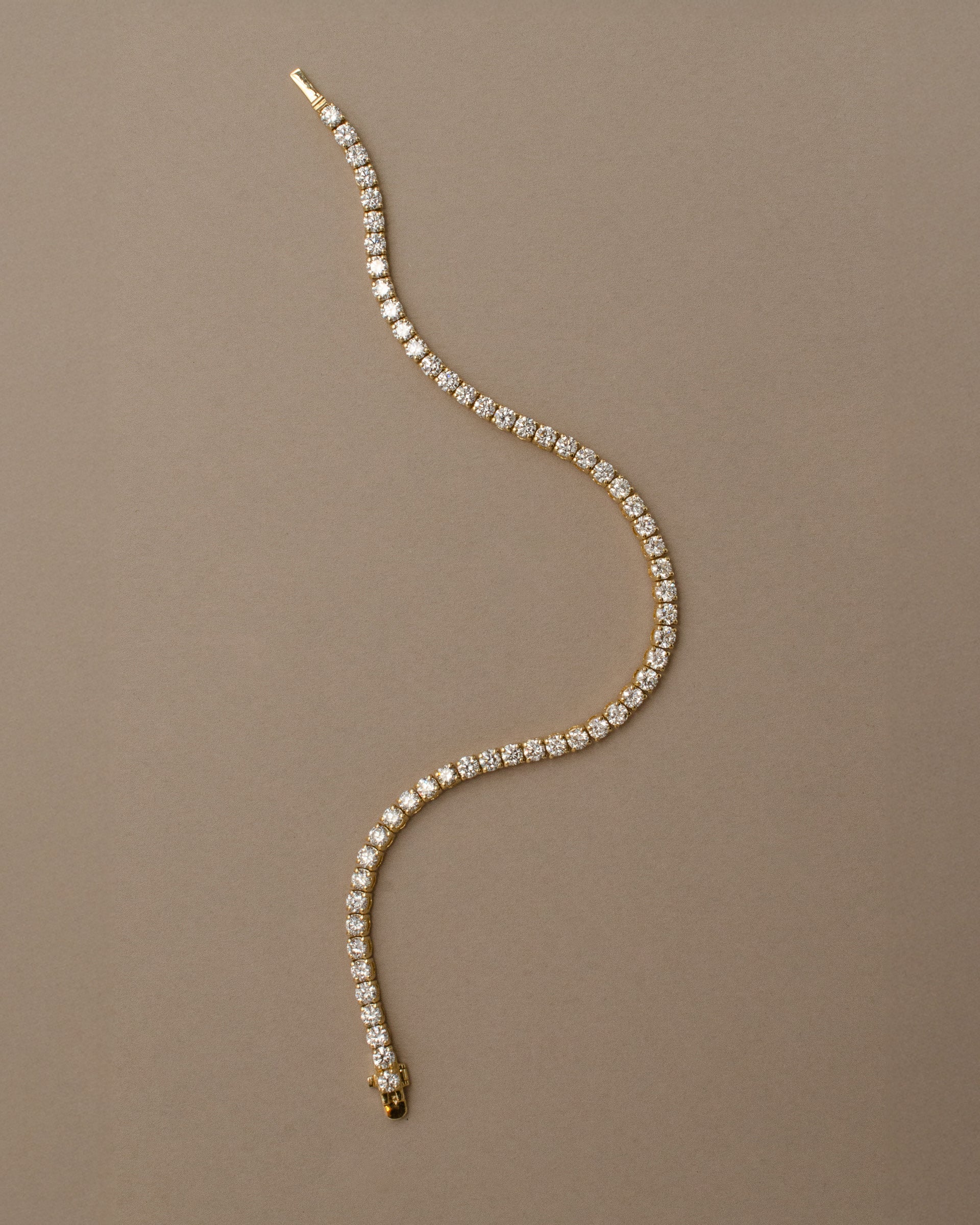 4 prong yellow gold tennis bracelet with diamonds