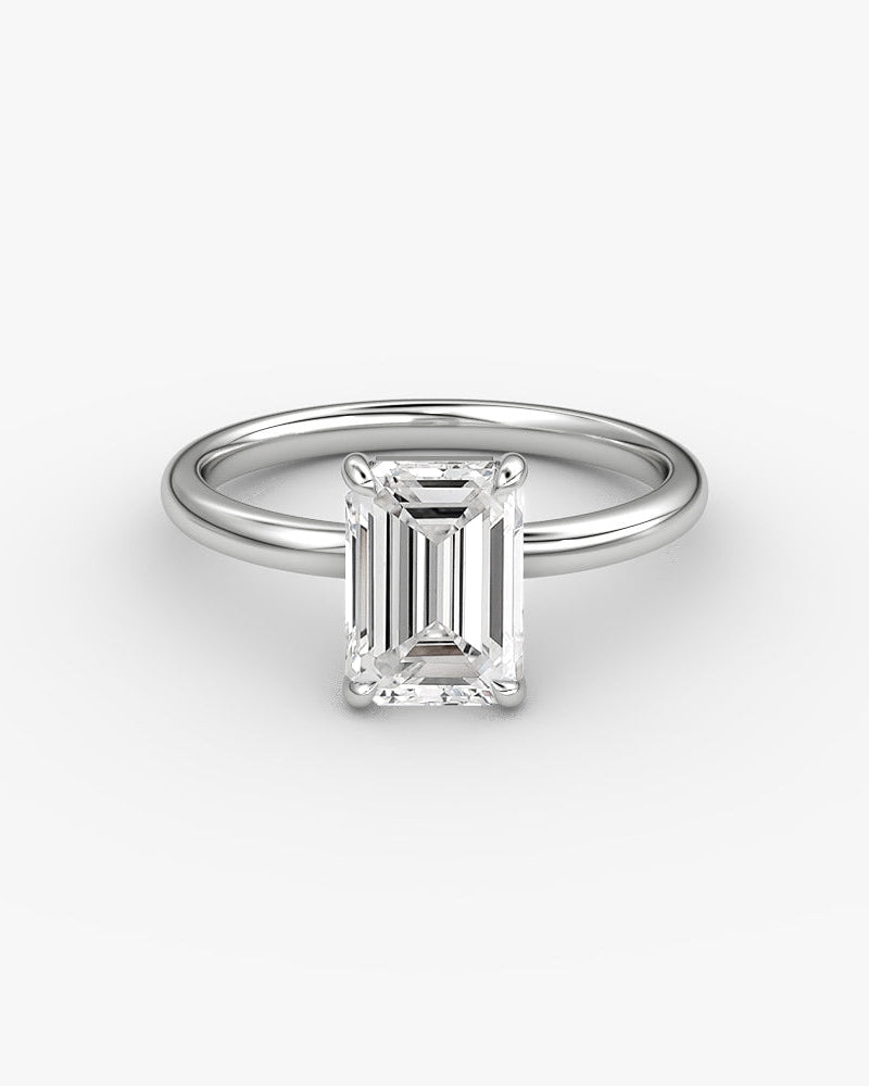 white gold engagement ring with an emerald cut diamond