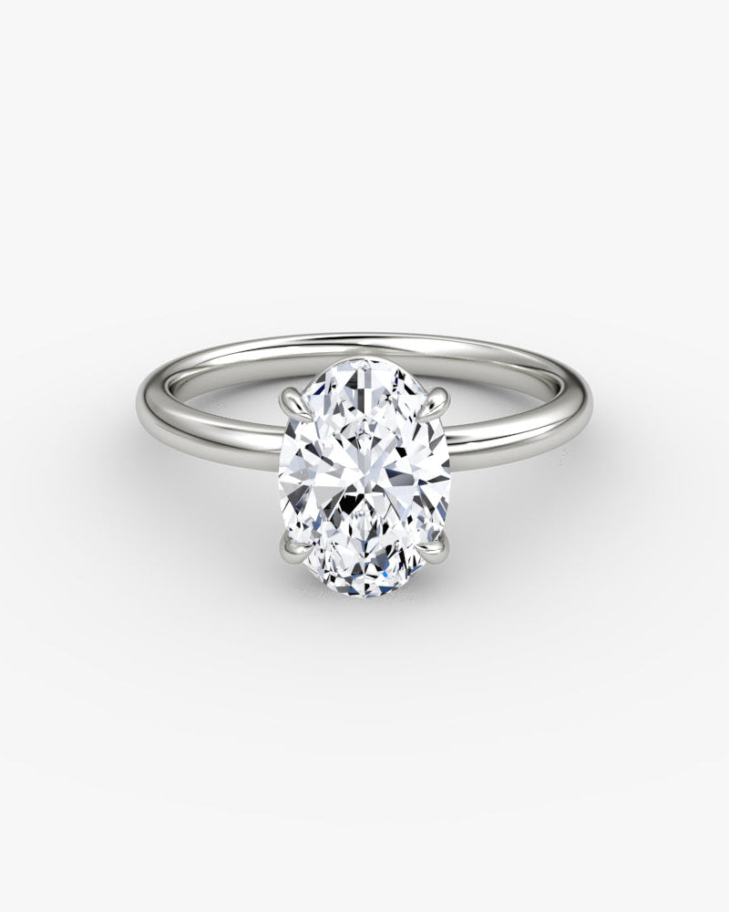 white gold engagement ring with an oval cut diamond