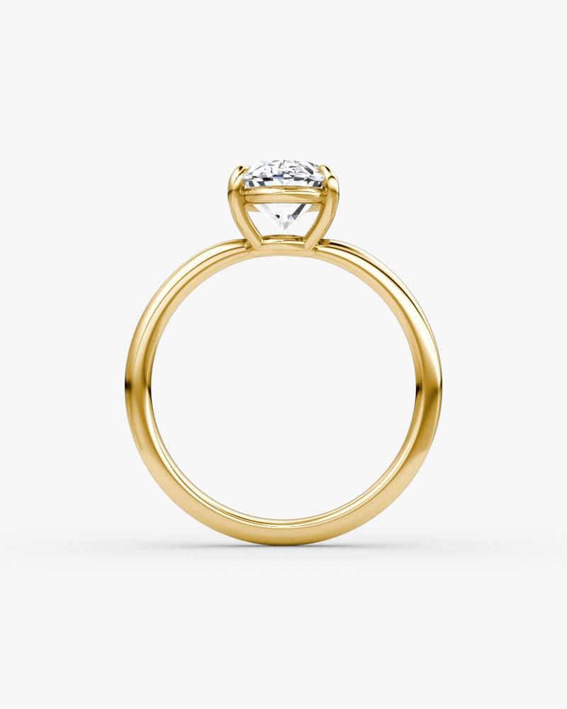 yellow gold engagement ring with an oval cut diamond