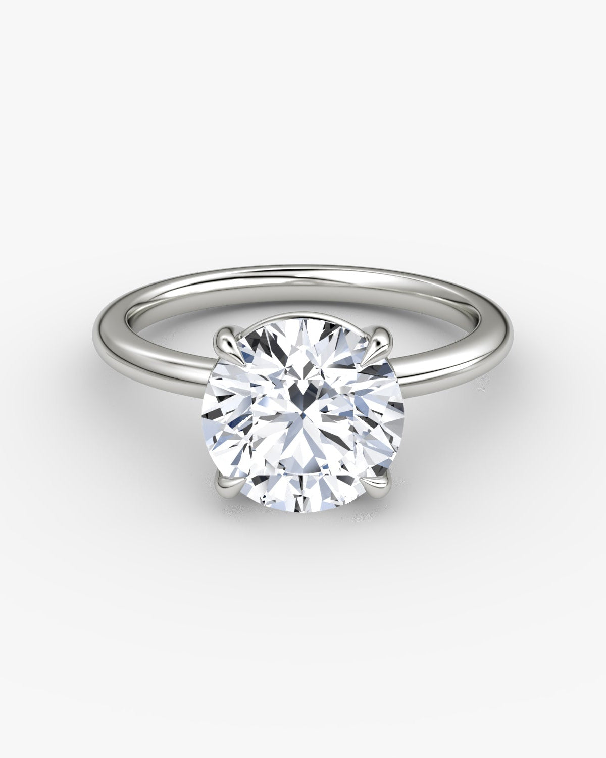 white gold engagement ring with round brilliant diamond