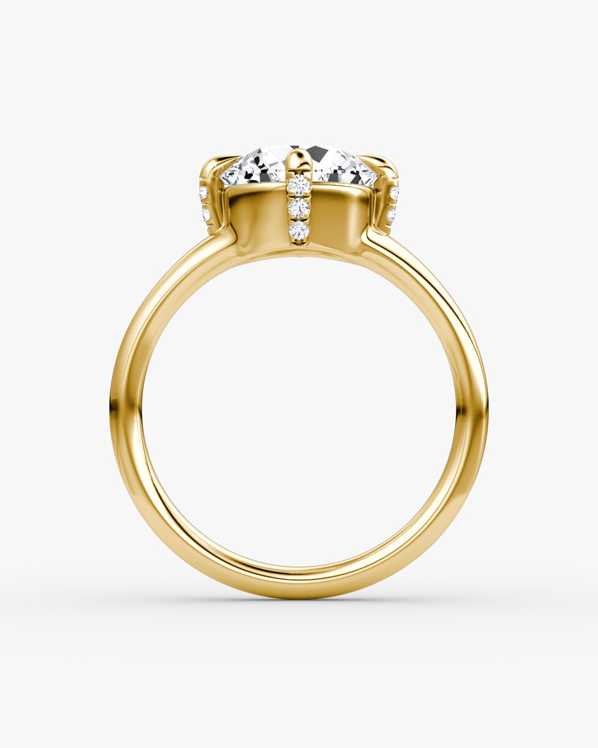 yellow gold engagement ring with an old european cut style diamond and pave on the prongs