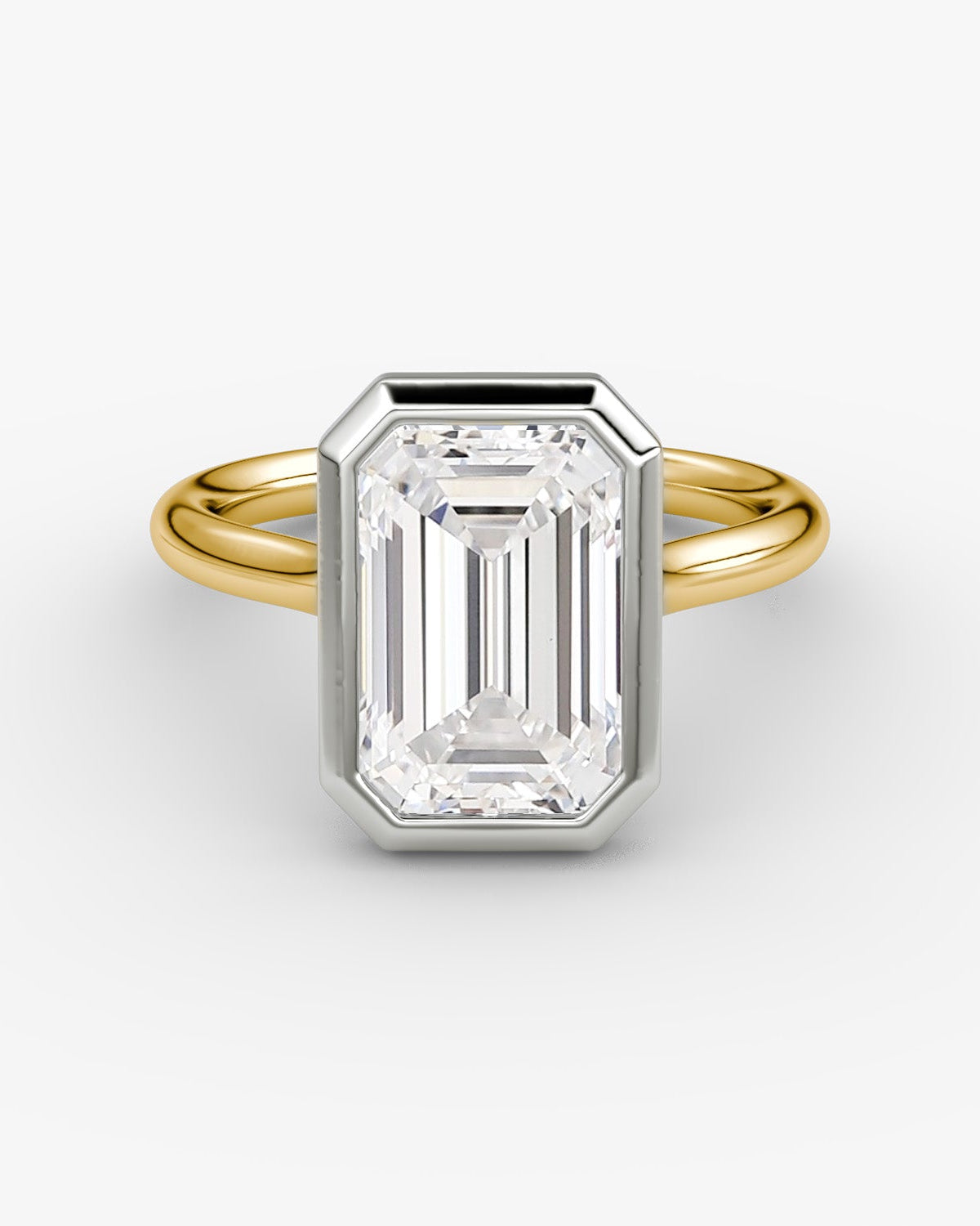 yellow gold engagement ring with a large emerald-cut bezel set diamond in a platinum setting