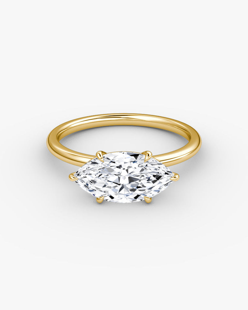 yellow gold engagement ring with marquise diamond