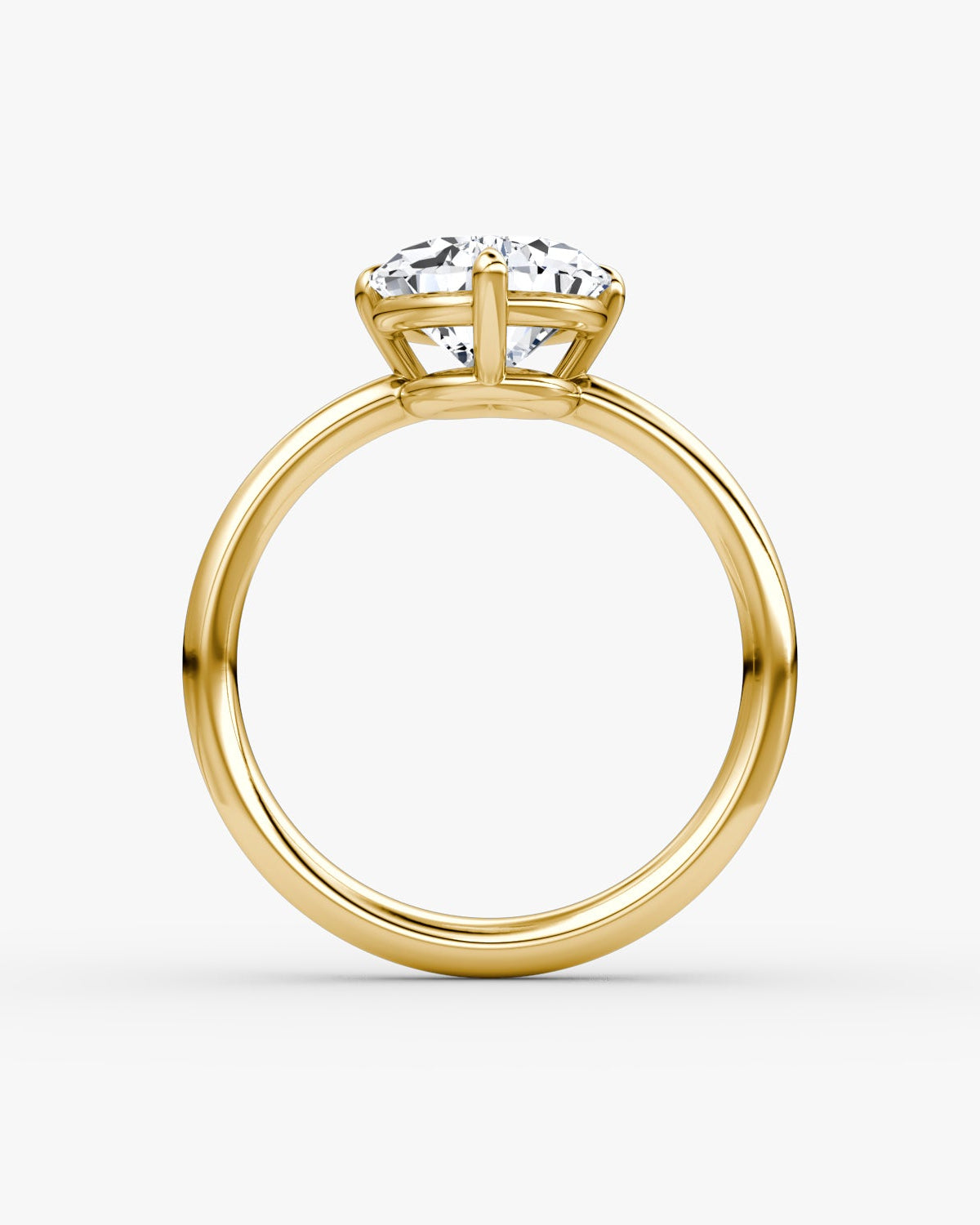 yellow gold engagement ring with a pear-shaped diamond