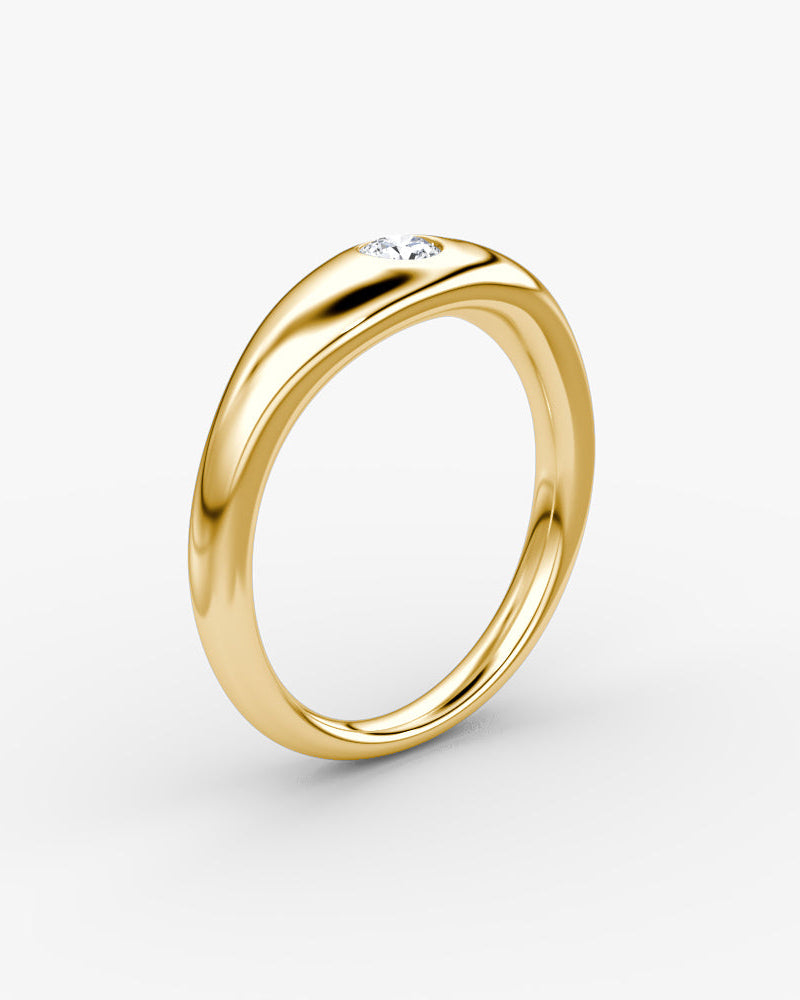 yellow gold engagement ring with a round brilliant diamond flush set 