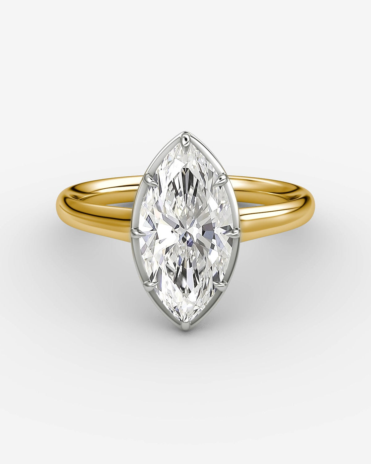 yellow gold engagement ring with a marquise diamond in a platinum setting