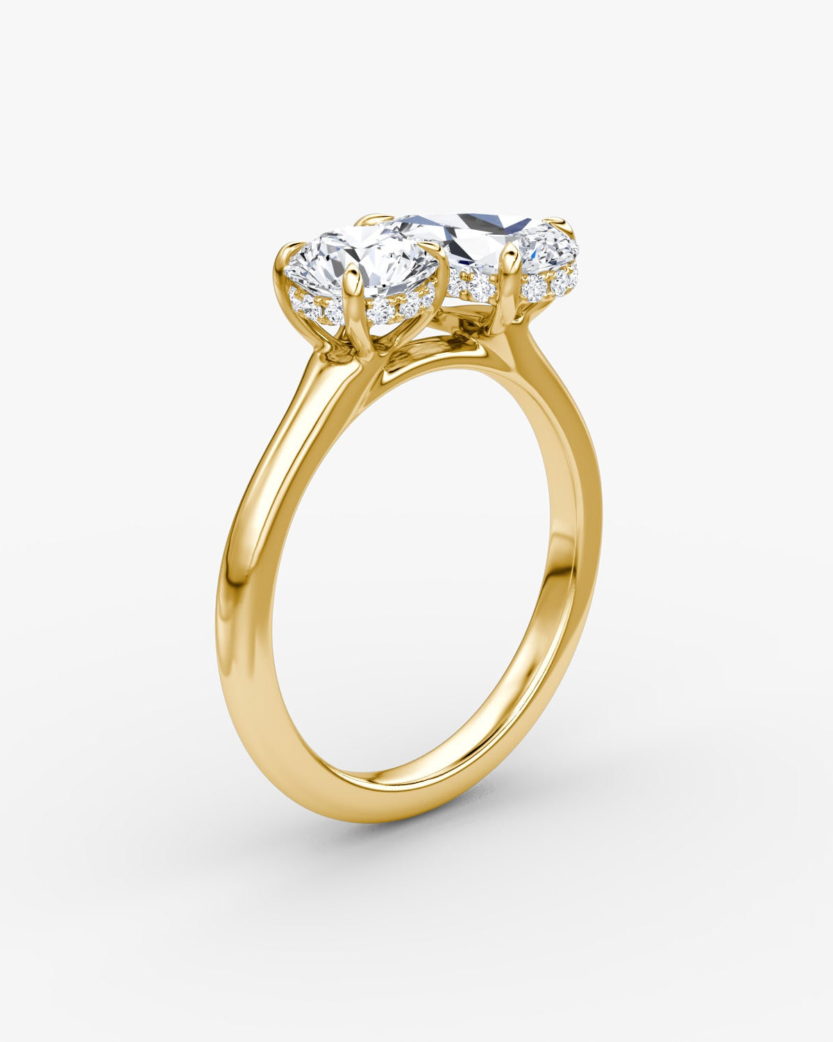 yellow gold two stone engagement ring with round and pear diamond and diamond pave