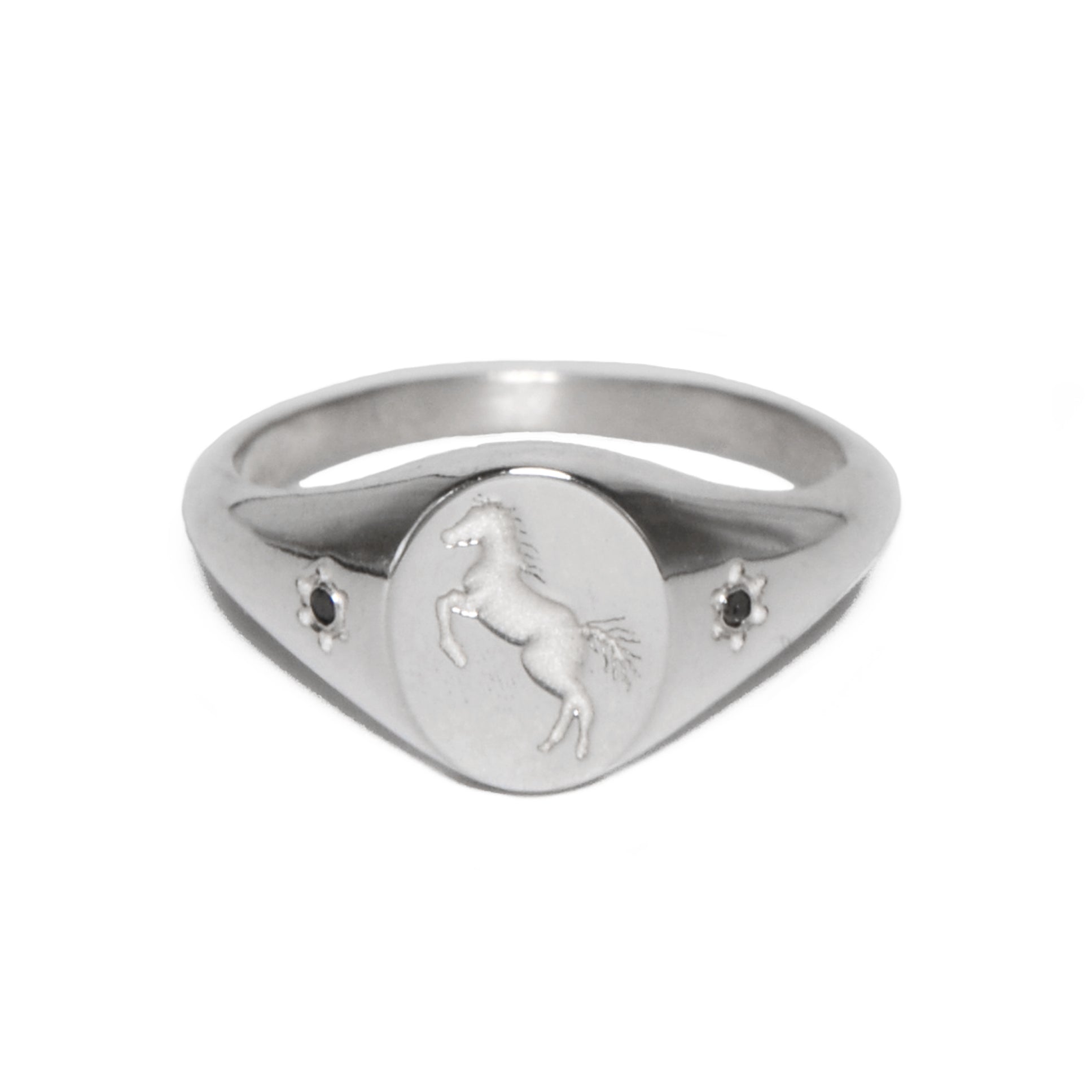 silver ring with pony engraving and stones