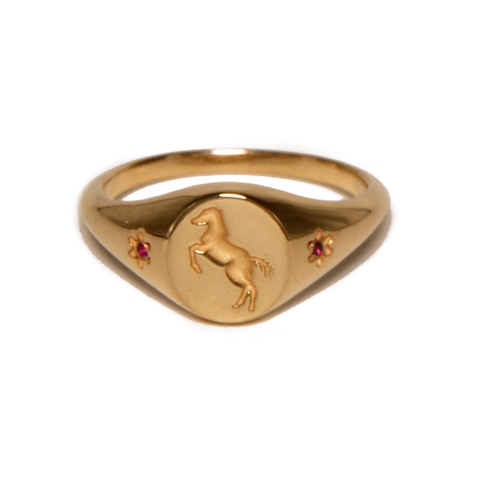 gold ring with pony engraving and rubies